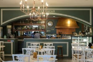 a restaurant with a chandelier hanging from the ceiling