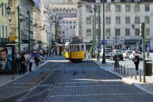 yellow and white tram on road during daytime