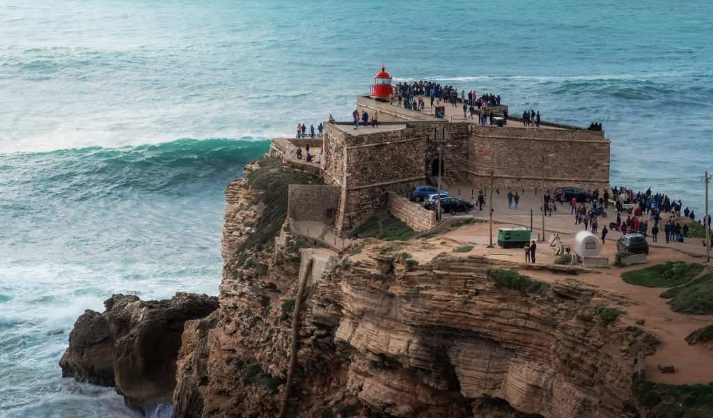 Big Waves of Nazare at Fort of Sao Miguel Arcanjo Lightouse - Nazare, Portugal